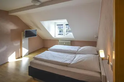 Ein Bett oder Betten in einem Zimmer der Unterkunft Gästehaus Rebstock