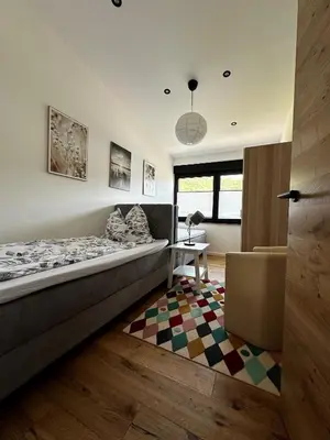 Ein Bett oder Betten in einem Zimmer der Unterkunft Ferienwohnungen Heimatliebe