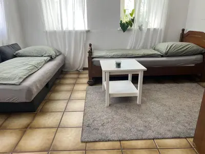Ein Bett oder Betten in einem Zimmer der Unterkunft Zimmer auf dem Scheuerhof
