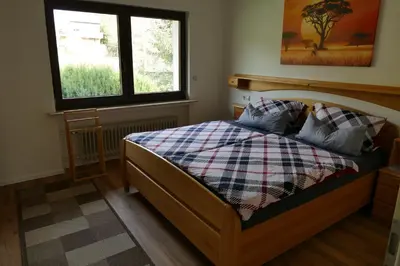Ein Bett oder Betten in einem Zimmer der Unterkunft Ferienwohnung Hilberath
