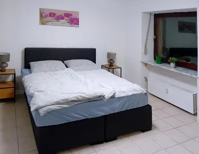 Ein Bett oder Betten in einem Zimmer der Unterkunft Haus am Burgring