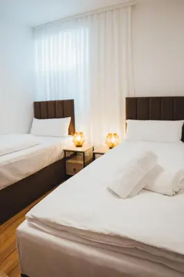 Ein Bett oder Betten in einem Zimmer der Unterkunft Rennglück Apartments