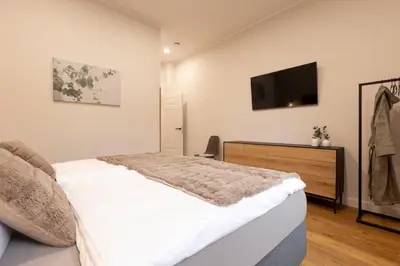 Ein Bett oder Betten in einem Zimmer der Unterkunft Kontor 22 - Luxus Ferienwohnung mit Sauna und Garten