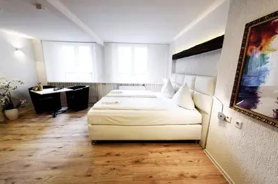 Ein Bett oder Betten in einem Zimmer der Unterkunft MoselUnion - Haus Burg Chaussee