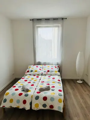 Ein Bett oder Betten in einem Zimmer der Unterkunft Reisende Ecke