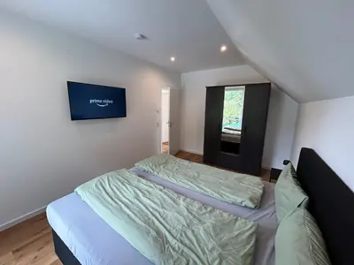 Ein Bett oder Betten in einem Zimmer der Unterkunft Wellness-Ferienhaus mit Dampfbad & Sauna am Nürburgring