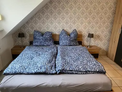 Ein Bett oder Betten in einem Zimmer der Unterkunft Ferienwohnung Maifeldblick Polch