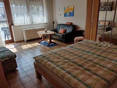 Ein Bett oder Betten in einem Zimmer der Unterkunft Ferienwohnung Huhn
