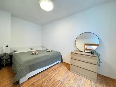 Ein Bett oder Betten in einem Zimmer der Unterkunft Großes Apartment an der Loreley