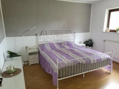 Ein Bett oder Betten in einem Zimmer der Unterkunft Ferienwohnung Mosel Hunsrück