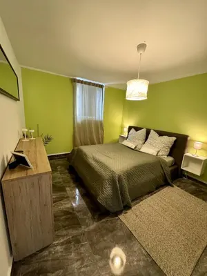 Ein Bett oder Betten in einem Zimmer der Unterkunft Gemütliche zentrale Unterkunft