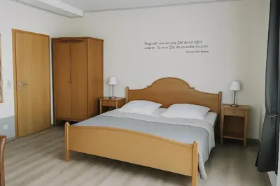Ein Bett oder Betten in einem Zimmer der Unterkunft Schloss Hotel Kastellaun