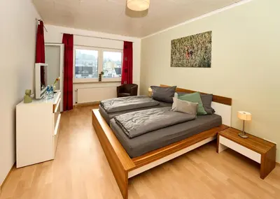 Ein Bett oder Betten in einem Zimmer der Unterkunft Landküche - Ferienwohnung