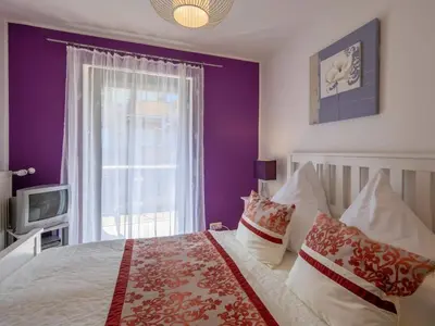Ein Bett oder Betten in einem Zimmer der Unterkunft Uitzicht op het meer - formerly TUI