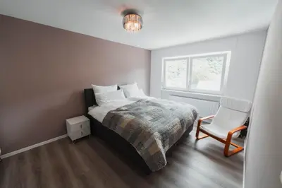 Ein Bett oder Betten in einem Zimmer der Unterkunft Julia's Mosel Villa Appartement TONY