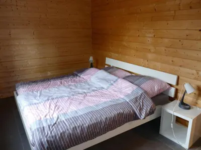 Ein Bett oder Betten in einem Zimmer der Unterkunft Holiday home family Junk