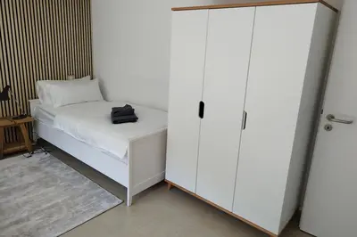 Ein Bett oder Betten in einem Zimmer der Unterkunft Apprimus Ferienwohnungen - Waldsee Rieden Panoramaterrasse 2 OG