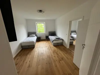 Ein Bett oder Betten in einem Zimmer der Unterkunft Rheinmosel Glück City