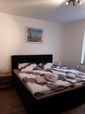 Ein Bett oder Betten in einem Zimmer der Unterkunft Ferienwohnung Philippi - Moselblick mit großer Dachterrasse, 75 qm, Hunde willkommen