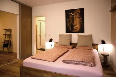 Ein Bett oder Betten in einem Zimmer der Unterkunft Ferienwohnung Pfaffenheck