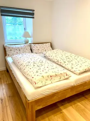 Ein Bett oder Betten in einem Zimmer der Unterkunft Kräuterküche