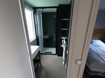 Ein Bett oder Betten in einem Zimmer der Unterkunft Mobilheim Ohara