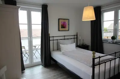 Ein Bett oder Betten in einem Zimmer der Unterkunft Pension Willebuhr