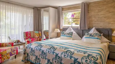 Ein Bett oder Betten in einem Zimmer der Unterkunft Ferienwohnung Studio Vulkanhöhe - im Maarberg Resort - in Schalkenmehren am See