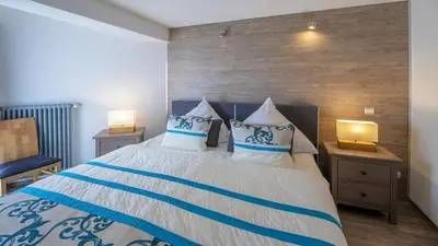 Ein Bett oder Betten in einem Zimmer der Unterkunft Ferienwohnung Ferienwohnung Maarhöhe - im Maarberg Resort - in Schalkenmehren am See