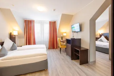 Ein Bett oder Betten in einem Zimmer der Unterkunft Landhotel am Wasserrad