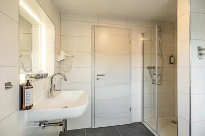 Ein Badezimmer in der Unterkunft EifelComfort Wohnen über den Dächern von Prüm mit der ganzen Familie