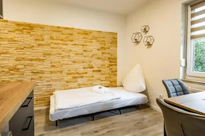 Ein Bett oder Betten in einem Zimmer der Unterkunft EifelComfort modernes Apartment in zentraler Lage