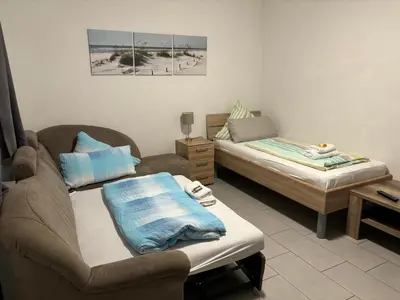 Ein Bett oder Betten in einem Zimmer der Unterkunft Haus Deutsches-Eck