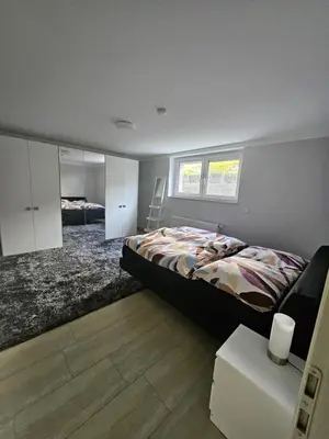 Ein Bett oder Betten in einem Zimmer der Unterkunft Ferienwohnung Trier Ruwer Mosel