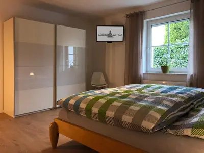 Ein Bett oder Betten in einem Zimmer der Unterkunft Destino - FeWo bei COCHEM mit beheiztem Pool