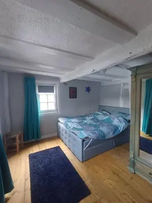 Ein Bett oder Betten in einem Zimmer der Unterkunft Landhaus Zum Nussbaum