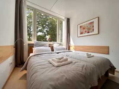 Ein Bett oder Betten in einem Zimmer der Unterkunft Idylle Apartments - Park & Therme