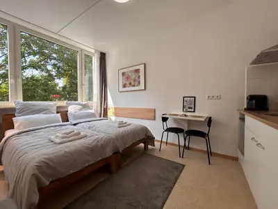 Ein Bett oder Betten in einem Zimmer der Unterkunft Idylle Apartments - Park & Therme