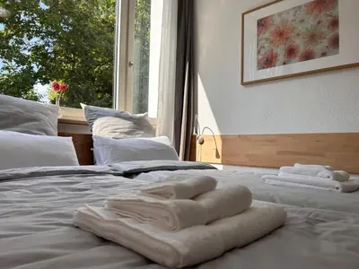 Ein Bett oder Betten in einem Zimmer der Unterkunft Idylle Apartments - Park & Therme