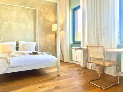 Ein Bett oder Betten in einem Zimmer der Unterkunft Minimalus Koblenz Apartment II