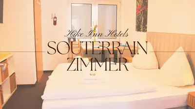 Ein Bett oder Betten in einem Zimmer der Unterkunft Hike Inn Hotels by Emmerich