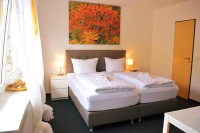 Ein Bett oder Betten in einem Zimmer der Unterkunft Hike Inn Hotels by Emmerich