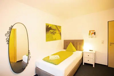 Ein Bett oder Betten in einem Zimmer der Unterkunft Hike Inn Hotels by Simonis