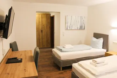 Ein Bett oder Betten in einem Zimmer der Unterkunft Hike Inn Hotels by Simonis