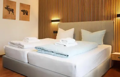 Ein Bett oder Betten in einem Zimmer der Unterkunft Hike Inn Hotels by Simonis