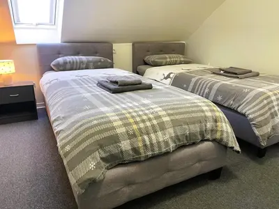 Ein Bett oder Betten in einem Zimmer der Unterkunft Pellinger-Hof