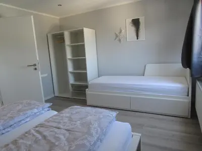 Ein Bett oder Betten in einem Zimmer der Unterkunft Ferienwohnungen Rheinhöhe