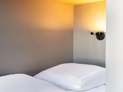 Ein Bett oder Betten in einem Zimmer der Unterkunft B&B HOTEL Idar-Oberstein