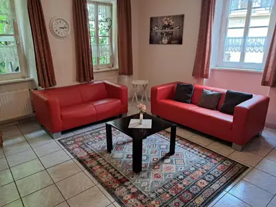 Ein Sitzbereich in der Unterkunft Ferienwohnung Jüngling
