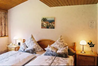 Ein Bett oder Betten in einem Zimmer der Unterkunft Pension Hilberath